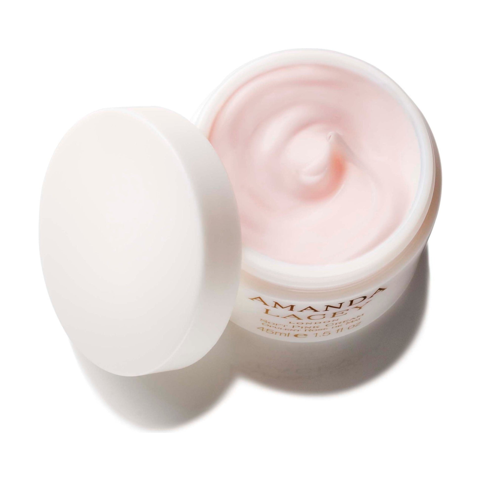 Amanda Lacey Soft Pink Cream, open frosted glass jar of pale pink cream with lid beside it
